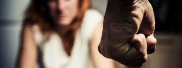 Persons Fist and out of focus women